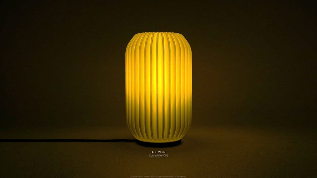 Front view of Kei 3D printed modern tabletop lamp in Artic White shade, showing sculpted spiral form with lamp on