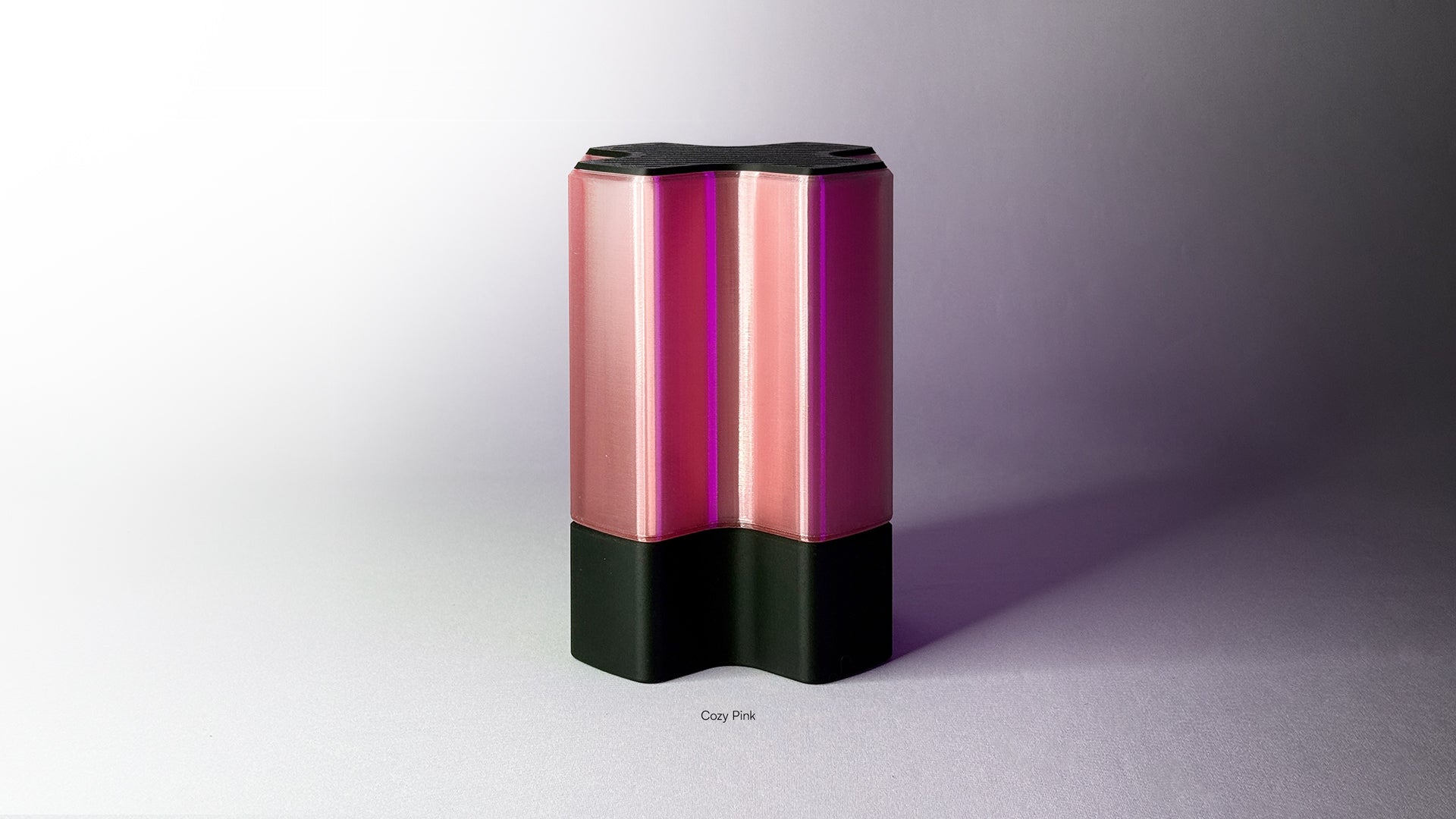 Front angled view of Nebu 3D printed modern tabletop lamp in Cozy Pink shade, showing double-walled transparent design with lamp off